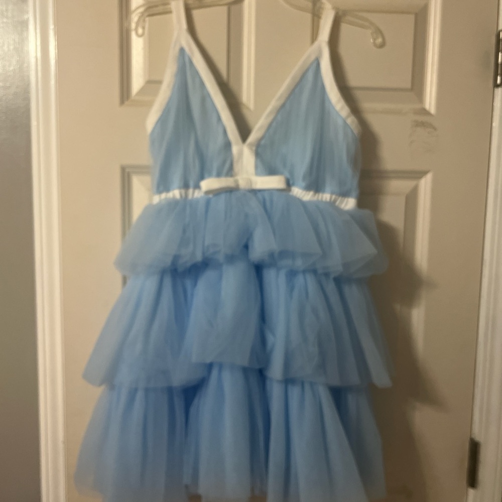Brand is Mable! Cute blue ruffle dress with white bow! Best fits size 8-10!